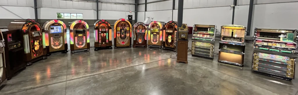 A lineup of antique and modern jukeboxes at the National Jukebox Exchange booth shown at the Chicagoland Jukebox, Slot Machine & Advertising show.